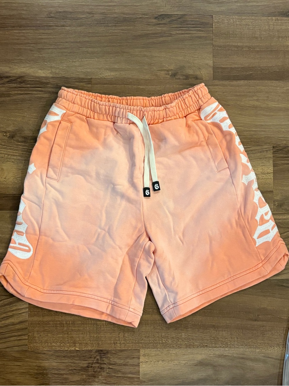 Men's Peach Athletic Drawstring Shorts with Side Script Accent